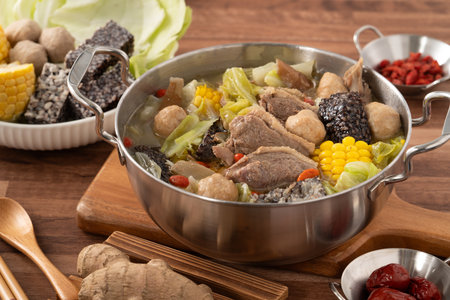 Delicious ginger duck stew hot pot soup with fresh vegetables in Taiwan.の写真素材