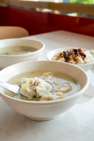 Wonton dumpling soup, distinctive and famous cuisine of Taiwanese street food.の写真素材