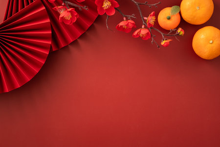 Chinese lunar new year background with fresh tangerine, red envelope, paper fan and decorations for Spring Festival.の写真素材