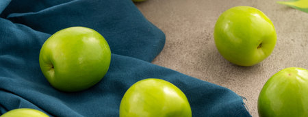 Fresh juicy delicious Taiwanese Milk Indian Jujube fruit in a basket on gray table background.の写真素材