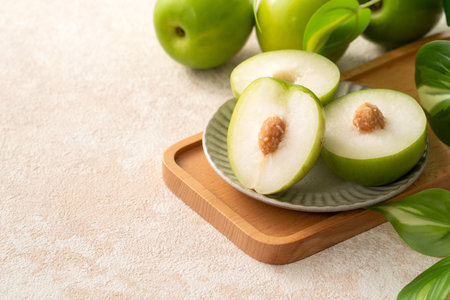 Fresh juicy delicious Taiwanese Milk Indian Jujube fruit in a basket on gray table background.の写真素材