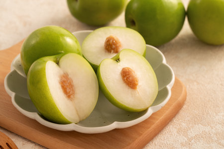 Fresh juicy delicious Taiwanese Milk Indian Jujube fruit in a basket on gray table background.の写真素材