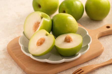Fresh juicy delicious Taiwanese Milk Indian Jujube fruit in a basket on gray table background.の写真素材