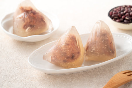 Zongzi, crystal ice rice dumpling for Dragon Boat Festival food with sweet bean paste filling.