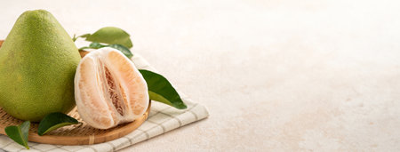 Fresh peeled pomelo with leaf on white table background for Mid-Autumn Festival fruit.の写真素材