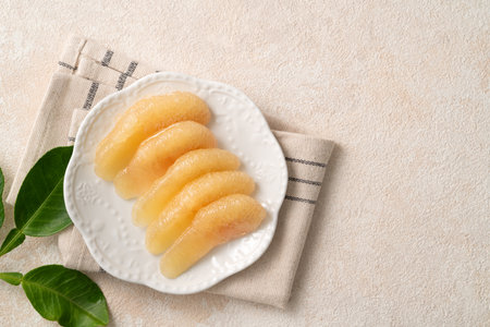 Fresh peeled pomelo with leaf on white table background for Mid-Autumn Festival fruit.の写真素材