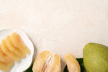 Fresh peeled pomelo with leaf on white table background for Mid-Autumn Festival fruit.の写真素材