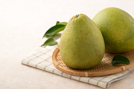Fresh peeled pomelo with leaf on white table background for Mid-Autumn Festival fruit.