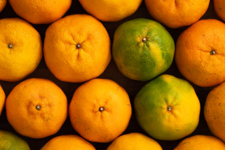 Fresh juice tangerine mandarin orange with leaf on wooden table background.の写真素材