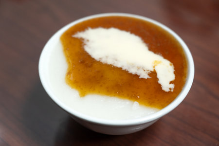 Taiwanese savory rice pudding rice cake with soy sauce in a bowl.の写真素材