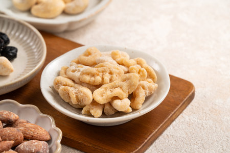Mixed nuts in bowls on white table background.の写真素材