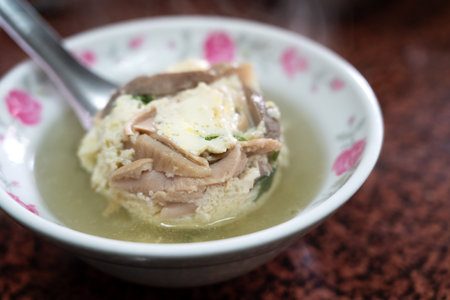 Delicious street food pig bone marrow soup with boiled egg drop in Changhua, Taiwan.の写真素材