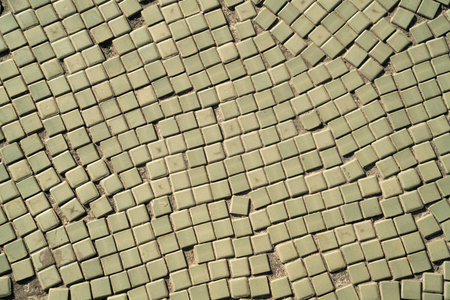 Beautiful green and beige mosaic tiles detail texture on the ground.の写真素材
