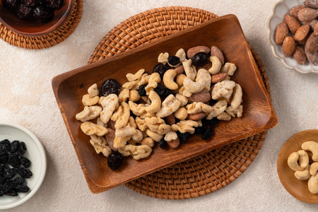 Flavored mixed nuts in bowls on white table background.の写真素材