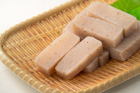 Raw konjac in square shape in a plate on white table background.の写真素材