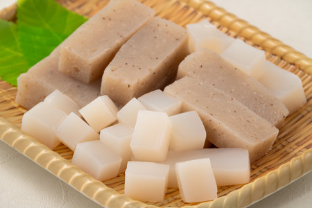 Raw konjac in square shape in a plate on white table background, also named konnyaku in Japan.の写真素材