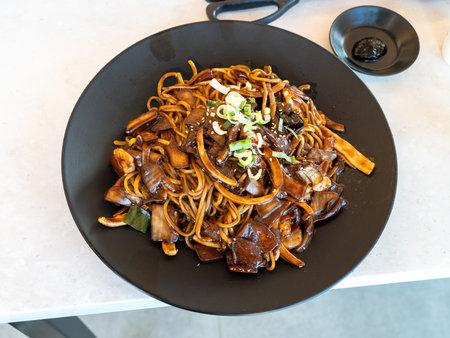 Delicious Jajangmyeon, jjajangmyeon, fried sauce noodle, Korean-style Chinese noodle dish topped with thick black bean paste sauce in south korea.の写真素材