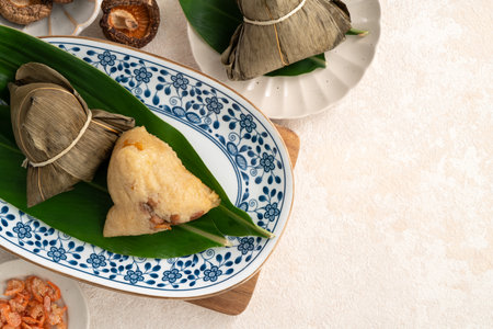 Zongzi, rice dumpling for Chinese traditional Dragon Boat Festival (Duanwu Festival) on white table background.の写真素材