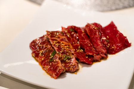 Marinated beef meat slices being grilled.の写真素材