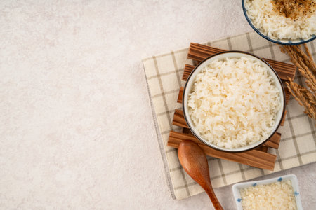 A bowl of fluffy white rice topped with rice seasonings.の写真素材