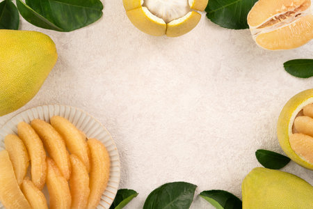 Fresh peeled pomelo with leaf on white table background for Mid-Autumn Festival fruit.の写真素材