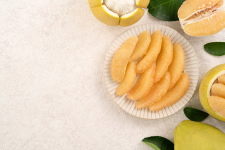 Fresh peeled pomelo with leaf on white table background for Mid-Autumn Festival fruit.の写真素材