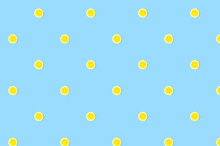Seamless pattern of fresh lemon round cut on blueの写真素材