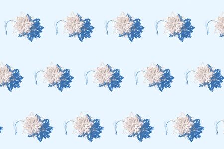 Silver sparkling snowflakes seamles pattern on light blue backgroundの写真素材