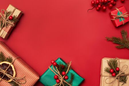 Chistmas red festive background with natural paper giftsの写真素材