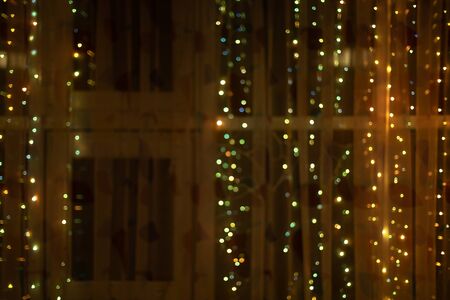 Festive christmas decorated window with bulb lightsの写真素材
