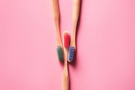 Colorful bamboo brushes on pink background, ecology products conceptの写真素材