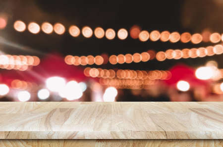 Empty Wooden table for product background design with bokeh lights