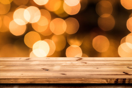Empty wooden table for product placement or montage with focus to the table top, blurred bokeh background with empty spaceの写真素材