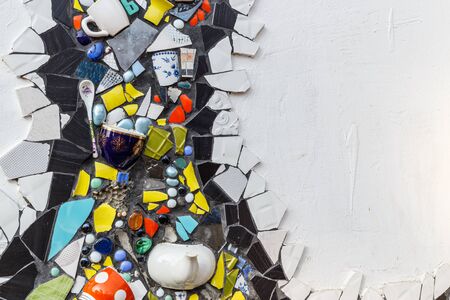 Colorful ceramic mosaic floor or wall. Creative recycled idea. Modern bathroom or kitchen floor design idea. Reused broken tile. Contemporary interior or outdoors design. Colored eastern potteryの写真素材
