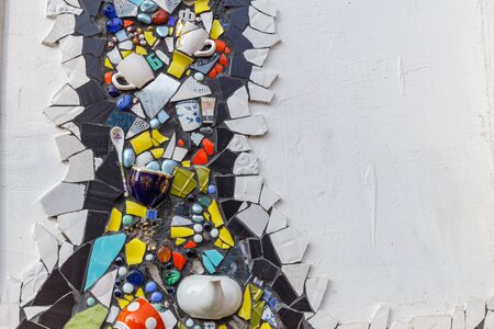Colorful ceramic mosaic floor or wall. Creative recycled idea. Modern bathroom or kitchen floor design idea. Reused broken tile. Contemporary interior or outdoors design. Colored eastern potteryの写真素材