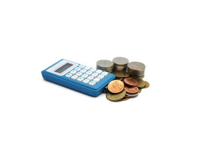 Thai baht coins and calculator isolated on white backgroundの写真素材