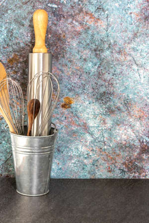 Set of kitchen utensil store in a tin in front view in vintage kitchen style.の写真素材