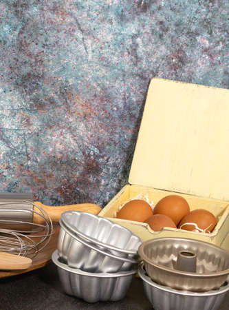 Set of baking utensil store with eggs in vintage kitchen style in front view.