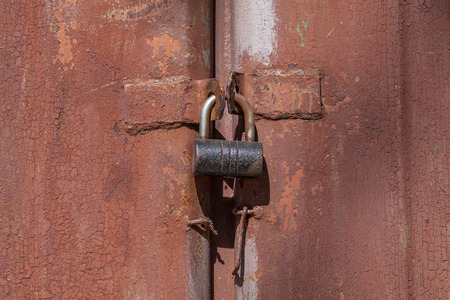 Steel lock on rusty metall backgroundの写真素材
