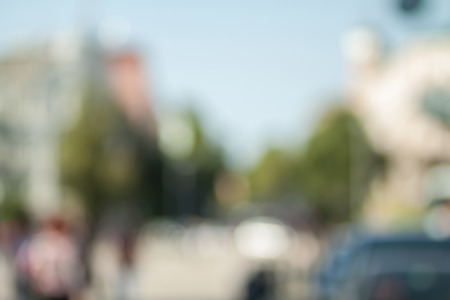 Blurred background photo.Cityscape bokeh. Defocused abstract city.Background out of focus.Can use as wallpaper, design. Summer blurry city backdrop.Travel out of focus photos. Fairy defocused photos.の写真素材