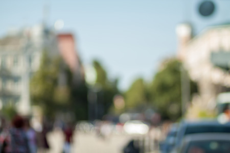 Blurred background photo.Cityscape bokeh. Defocused abstract city.Background out of focus.Can use as wallpaper, design. Summer blurry city backdrop.Travel out of focus photos. Fairy defocused photos.の写真素材