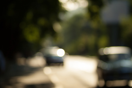 Blurred background photo.Cityscape bokeh. Defocused abstract city.Background out of focus.Can use as wallpaper, design. Summer blurry city backdrop.Travel out of focus photos. Fairy defocused photos.の写真素材