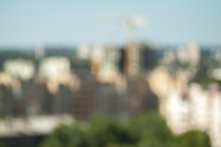 Blurred background photo.Cityscape bokeh. Defocused abstract city.Background out of focus.Can use as wallpaper, design. Summer blurry city backdrop.Travel out of focus photos. Fairy defocused photos.の写真素材