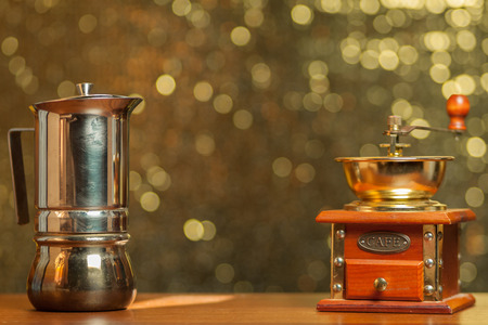 Coffee mill backdrop. Vintage bokeh background. Coffee make background. Gold retro bokeh. Cofee maker. Old coffee grinder.の写真素材
