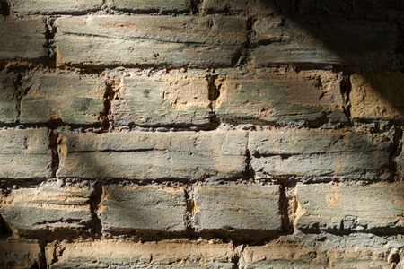 Vintage street brick background. Weathered texture of stainted old brik wall. Grunge rusty blocks. Urban wallpaper. Nature artistic texture. Urban art. Ethnic ornament. White brick wall.の写真素材