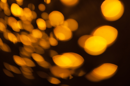 Vintage bokeh background. Gold retro bokeh. Fairy defocused backdrop. Hipster photo wallpaper. Chicago style. Party invitation template. Celebration wallpaper. Blurry lights.の写真素材
