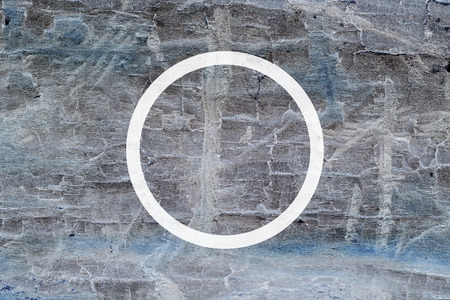 White flat circle on abstract stone background. Abstract psychedelic background.
