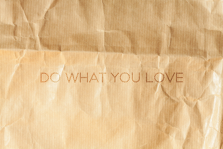 Do what you love. Inspiration card on crumpled paper background.の写真素材