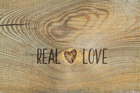 Love. Romantic card with natural wooden backgroundの写真素材