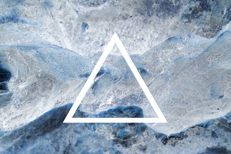 White flat triangle on abstract stone background. Abstract psychedelic background.の写真素材